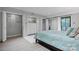 Light and airy bedroom featuring closets, mirrored storage, and sliding glass door to a balcony at 5192 Corbin Ln, Hickory, NC 28601