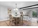 Cozy dining area with hardwood floors, stylish decor, and an adjacent living space with exposed beams at 5192 Corbin Ln, Hickory, NC 28601