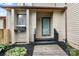 This charming townhouse features a welcoming entrance with lush landscaping at 5192 Corbin Ln, Hickory, NC 28601