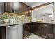 This kitchen showcases stainless appliances, sleek cabinetry, and modern backsplash at 5192 Corbin Ln, Hickory, NC 28601