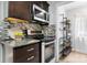Modern kitchen with stainless steel appliances, granite countertops, and a mosaic tile backsplash at 5192 Corbin Ln, Hickory, NC 28601