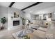 Spacious living room with exposed beams, fireplace, and a comfortable seating area with stylish decor at 5192 Corbin Ln, Hickory, NC 28601