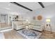 Open-concept living room with modern decor and seamless flow to the dining area at 5192 Corbin Ln, Hickory, NC 28601