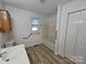 Bright bathroom with a shower/tub combo and neutral vanity at 5238 Bethel Church Rd, Hickory, NC 28602