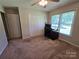 Bedroom featuring carpeted floors, a ceiling fan, and a window providing ample natural light at 5238 Bethel Church Rd, Hickory, NC 28602