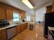 Well-lit kitchen featuring wood cabinets, stainless steel appliances, and an open layout at 5238 Bethel Church Rd, Hickory, NC 28602
