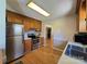 Modern kitchen with stainless steel appliances, wooden cabinets, and hardwood flooring at 5238 Bethel Church Rd, Hickory, NC 28602