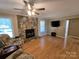 Cozy living room with a stone fireplace and hardwood floors, perfect for relaxing at 5238 Bethel Church Rd, Hickory, NC 28602