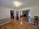 Spacious living room with hardwood floors, stone fireplace, and an open concept design at 5238 Bethel Church Rd, Hickory, NC 28602