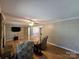 Bright living room with hardwood floors, a ceiling fan, and comfortable armchairs at 5238 Bethel Church Rd, Hickory, NC 28602