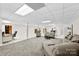 A view of the spacious carpeted basement, featuring a comfortable seating area and a work-from-home space at 600 Queens Rd, Cherryville, NC 28021