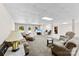 Spacious basement living room with plush seating, carpet, and a dedicated office area at 600 Queens Rd, Cherryville, NC 28021