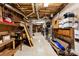 Unfinished basement storage area with exposed pipes and a cluttered but functional layout at 600 Queens Rd, Cherryville, NC 28021