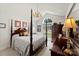 Bedroom featuring neutral walls, four-poster bed, elegant chandelier and ample natural light at 600 Queens Rd, Cherryville, NC 28021