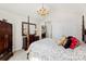This bedroom is beautifully furnished with dark wood furniture and neutral walls at 600 Queens Rd, Cherryville, NC 28021
