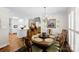 Charming dining room featuring hardwood floors, elegant decor, and a view of the kitchen at 600 Queens Rd, Cherryville, NC 28021