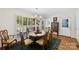 Dining area with natural light from shuttered windows, and hardwood floors at 600 Queens Rd, Cherryville, NC 28021