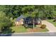 Lovely single-story brick home featuring a large front yard, mature trees, and a welcoming walkway at 600 Queens Rd, Cherryville, NC 28021