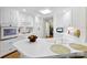 Well-lit kitchen featuring white cabinets, modern appliances, and ample counter space at 600 Queens Rd, Cherryville, NC 28021