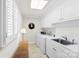 Functional laundry room with white cabinets, a utility sink, and included washer and dryer at 600 Queens Rd, Cherryville, NC 28021
