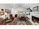 Comfortable living room with a fireplace, hardwood floors, and a vaulted ceiling at 600 Queens Rd, Cherryville, NC 28021