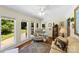 Bright sitting room features hardwood floors, natural light, and access to the outdoor deck at 600 Queens Rd, Cherryville, NC 28021