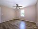 Cozy bedroom with a window for natural light and neutral walls at 618 Springfield Nw Dr, Concord, NC 28027