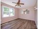 Bright room with laminate floors and natural light through a large window at 618 Springfield Nw Dr, Concord, NC 28027