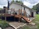 Spacious wooden deck with black metal railing and steps, perfect for outdoor relaxation at 618 Springfield Nw Dr, Concord, NC 28027