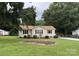 Charming single-story home featuring a well-maintained lawn and inviting curb appeal at 618 Springfield Nw Dr, Concord, NC 28027