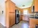Bright kitchen with stainless steel refrigerator, ample cabinet space, and modern appliances at 618 Springfield Nw Dr, Concord, NC 28027