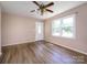 A bright living room with laminate floors and a white door at 618 Springfield Nw Dr, Concord, NC 28027