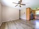 Spacious living room featuring laminate flooring adjacent to the kitchen at 618 Springfield Nw Dr, Concord, NC 28027