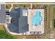 Community clubhouse with a stunning pool, lounge chairs, and manicured landscaping from an aerial view at 6365 Ashton Park Dr, Denver, NC 28037