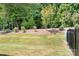 View of the back yard with new grass at 6365 Ashton Park Dr, Denver, NC 28037