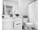 Bright bathroom featuring a modern vanity and classic white fixtures at 6365 Ashton Park Dr, Denver, NC 28037
