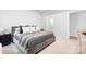 Comfortable bedroom with plush bed, decorative pillows, and ample natural light next to an ensuite bathroom at 6365 Ashton Park Dr, Denver, NC 28037