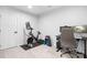 Home gym with a Peloton bike, weights, and an office setup at 6365 Ashton Park Dr, Denver, NC 28037