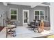 Back patio area with comfortable seating, plants, and natural light at 6365 Ashton Park Dr, Denver, NC 28037