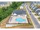 Aerial shot of a community pool, clubhouse, seating area, and manicured landscaping at 6365 Ashton Park Dr, Denver, NC 28037
