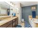 Well-lit bathroom featuring a double vanity, a soaking tub, and tasteful tile accents at 6412 Bluegill Rd, Charlotte, NC 28216