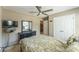 Inviting bedroom with a ceiling fan, a dresser with mirror, and a closet for ample storage at 6412 Bluegill Rd, Charlotte, NC 28216