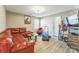 Cozy room features a comfortable leather couch, with a reading chair and exercise equipment at 6412 Bluegill Rd, Charlotte, NC 28216