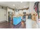 Stylish kitchen with a blue island, stainless steel appliances, white cabinets, and granite countertops at 6412 Bluegill Rd, Charlotte, NC 28216