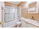 This bathroom features a shower-tub combo with sliding glass doors and a vanity with a sink and mirror at 6414 Goldenblush Cir, Charlotte, NC 28269