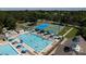 Community aerial view of a pool, tennis courts and recreational area with plenty of lounge seating at 6711 Creft Cir, Lake Park, NC 28079
