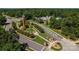 Community view showcasing the clock tower, pool, clubhouse and meticulously maintained green spaces at 6711 Creft Cir, Lake Park, NC 28079