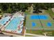 Community aerial view featuring a pool, tennis, and recreational area with lush landscaping and amenities at 6711 Creft Cir, Lake Park, NC 28079