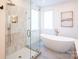 Bright bathroom with spacious shower, soaking tub, and tiled floors at 6711 Creft Cir, Lake Park, NC 28079