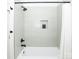 Modern bathroom featuring a shower and bathtub with light green tile and black fixtures at 6711 Creft Cir, Lake Park, NC 28079